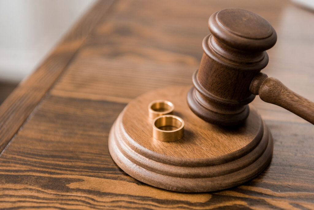 Contested Divorce Lawyer Brandon, FL - gavel and wedding bands on wood table