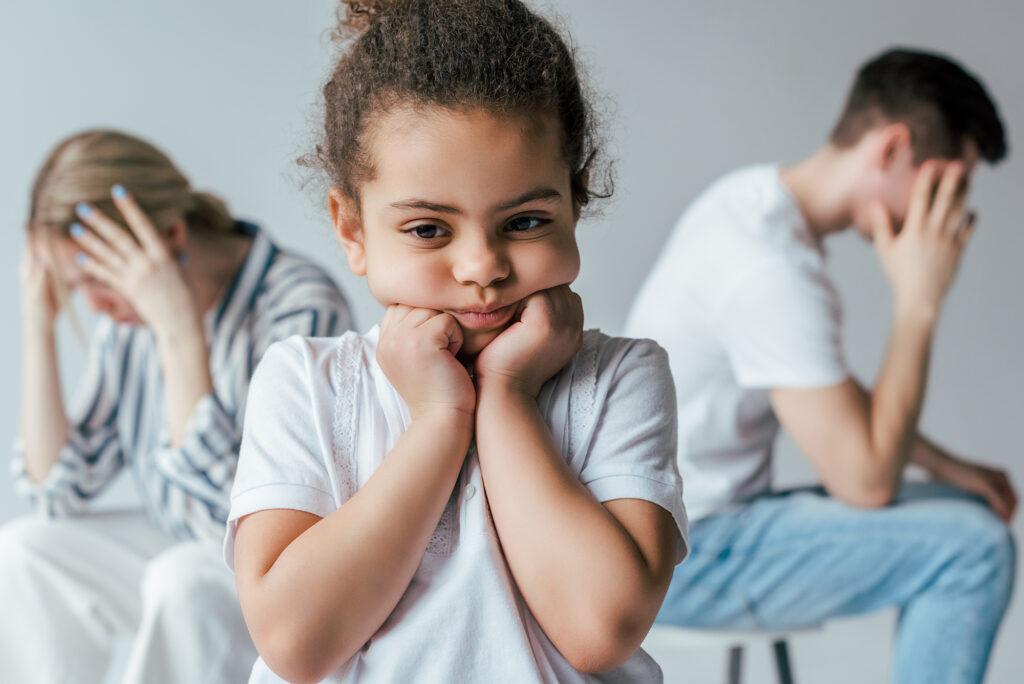 child between two upset adults