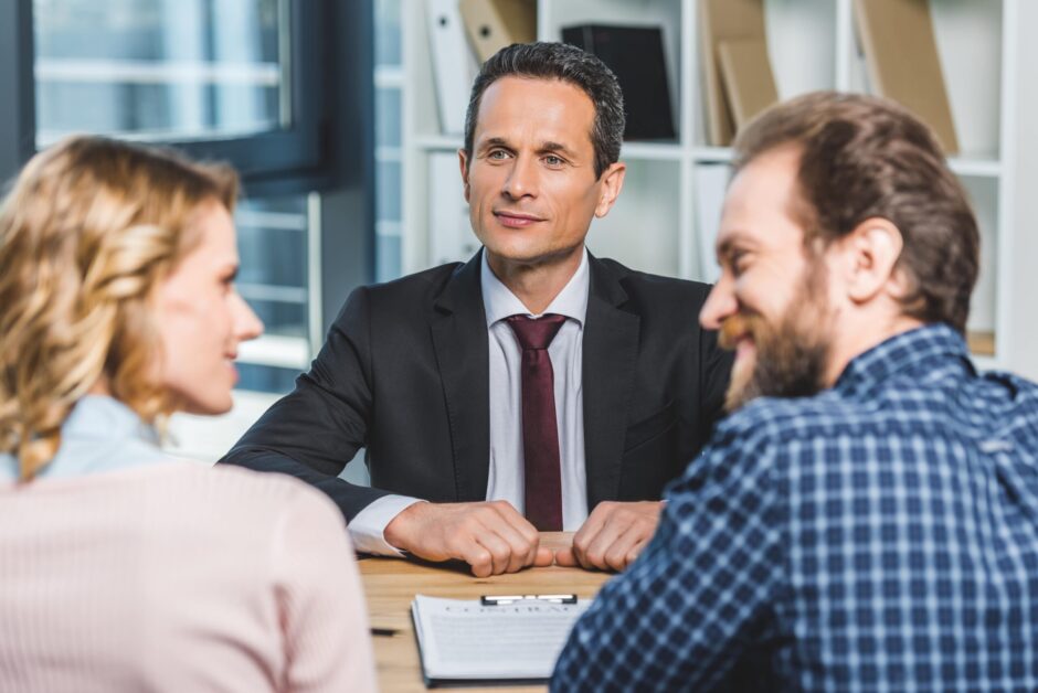 Lawyer sitting between a couple